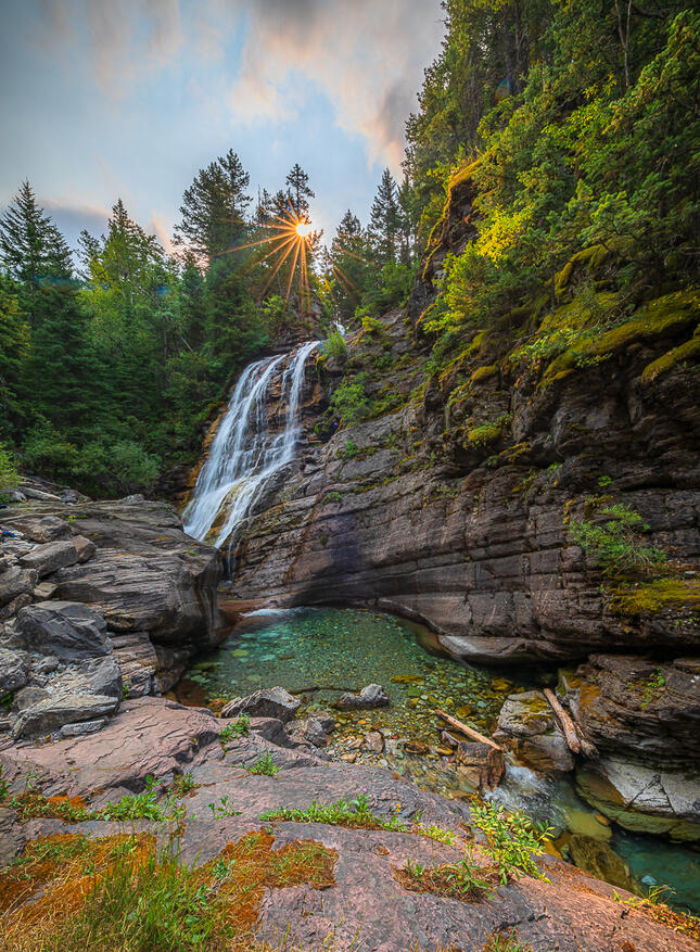 Sunrise Over a Waterfall